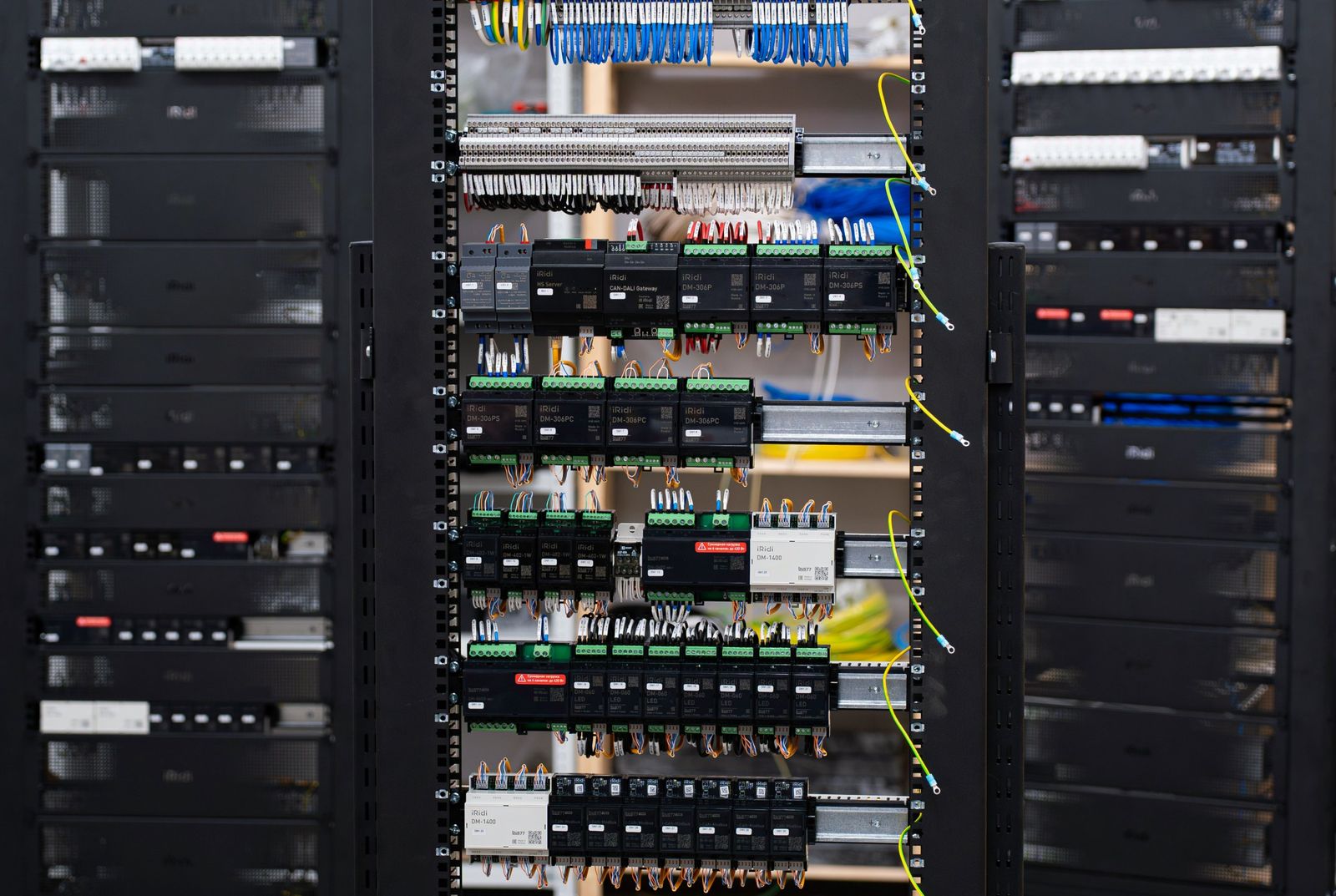 Control rack with labeled wiring and DIN-rail modules
